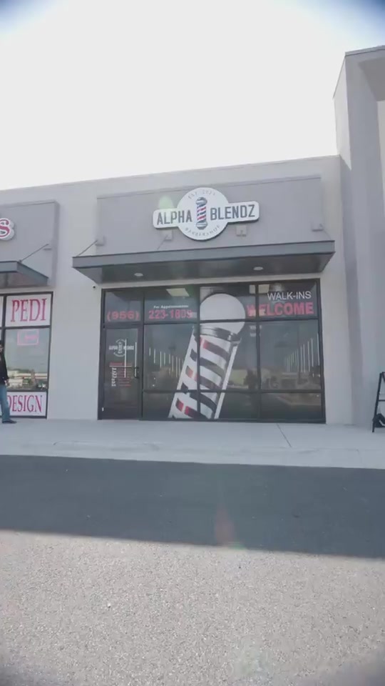 The Alpha Blendz storefront on North Raul Longoria Road, with the barber pole in the window